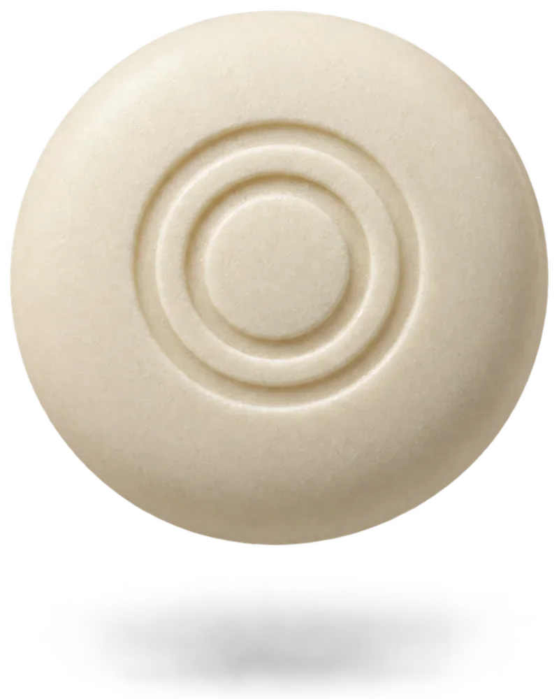 Round cream-colored mint with an embossed double-ring logo