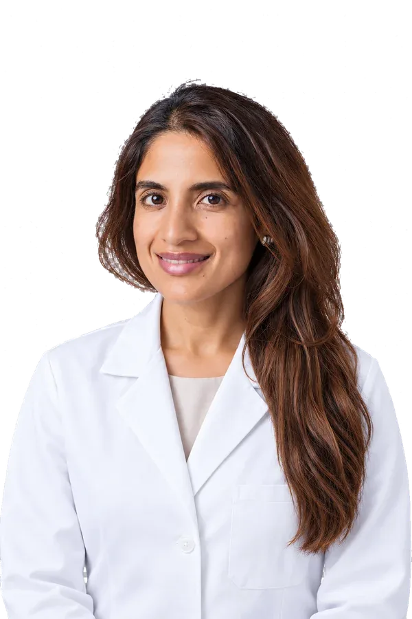 Dr. Aurora Alva, licensed dentist, in a white coat
