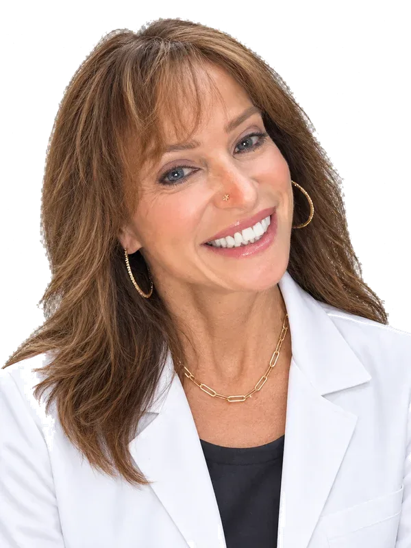 Dr. Katina Spadoni, licensed dentist, in a white coat